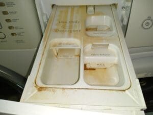 Detergent drawer in washer before cleaning with ClO2