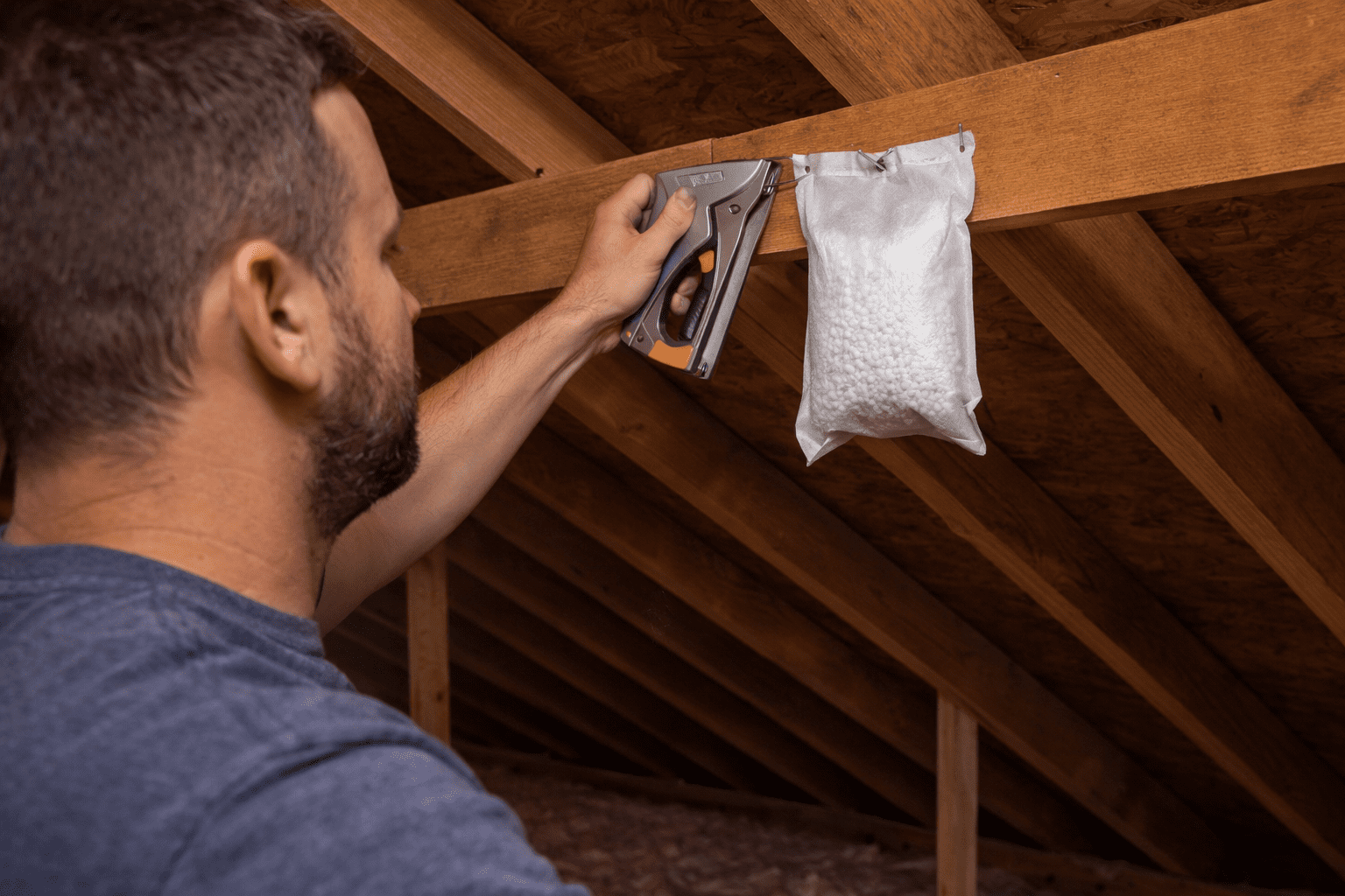 Stapling STOW-AWAY 90 in an attic {{brizy_dc_image_alt imageSrc=